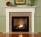 Granite facing kit shown with a fireplace mantel with dentil molding underneath the top shelf.