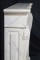 The sides of this Louis XVI Marble Mantel have a raised panel design, and scrolled leg ornamentation