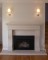 Clean lines mark this subtle but stylish stone mantel