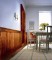 Classic Rustic distressed hand-scraped maple, show here using our Classic Rustic Casing Pak to frame a door in a dining room.