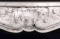 Detailed acanthus leaf, shell and floral spray give this Louis XV marble mantel are delicate touches to this full size French design.