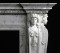 5 This marble mantel features dentil molding, tiered top mantel shelving, and beautifully crafted Caryatids, with no veining touching the faces.