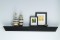 This modern mantel shelf can be used alone, on any wall