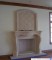 Custom overmantels are available for this stone mantel