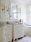 This bathroom was given classic appeal with 4" pattern Birch Bead board installed above as well as below a chair rail