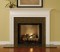 Installed wood mantel with a granite facing kit.