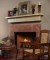Marble facing shown with a wood mantel shelf.