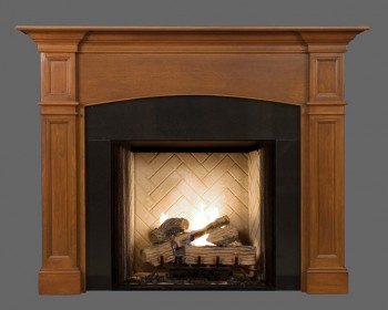 The Hanford Fireplace Mantel, complete with an arch and distinctive recessed panels.