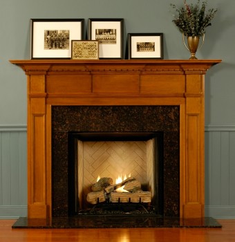 Be the envy of your friends with this gorgeous custom wood fireplace mantel featuring panels and dentil molding