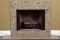 A installed Venetian gold granite fireplace facing.