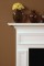 The pop out wood frames are carefully carved into the custom made fireplace mantel.