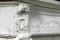 Corner blockings of wreaths and scrolling acanthus leaf are featured in this Louis XVI Marble Mantel