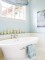 Bead board wainscoting used with a handy ledge in this bathroom