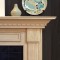 Dentil Molding, raised molding and fluted legs are featured on the fireplace mantel