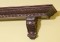 An elegant mantel shelf with beautiful hand carved designs