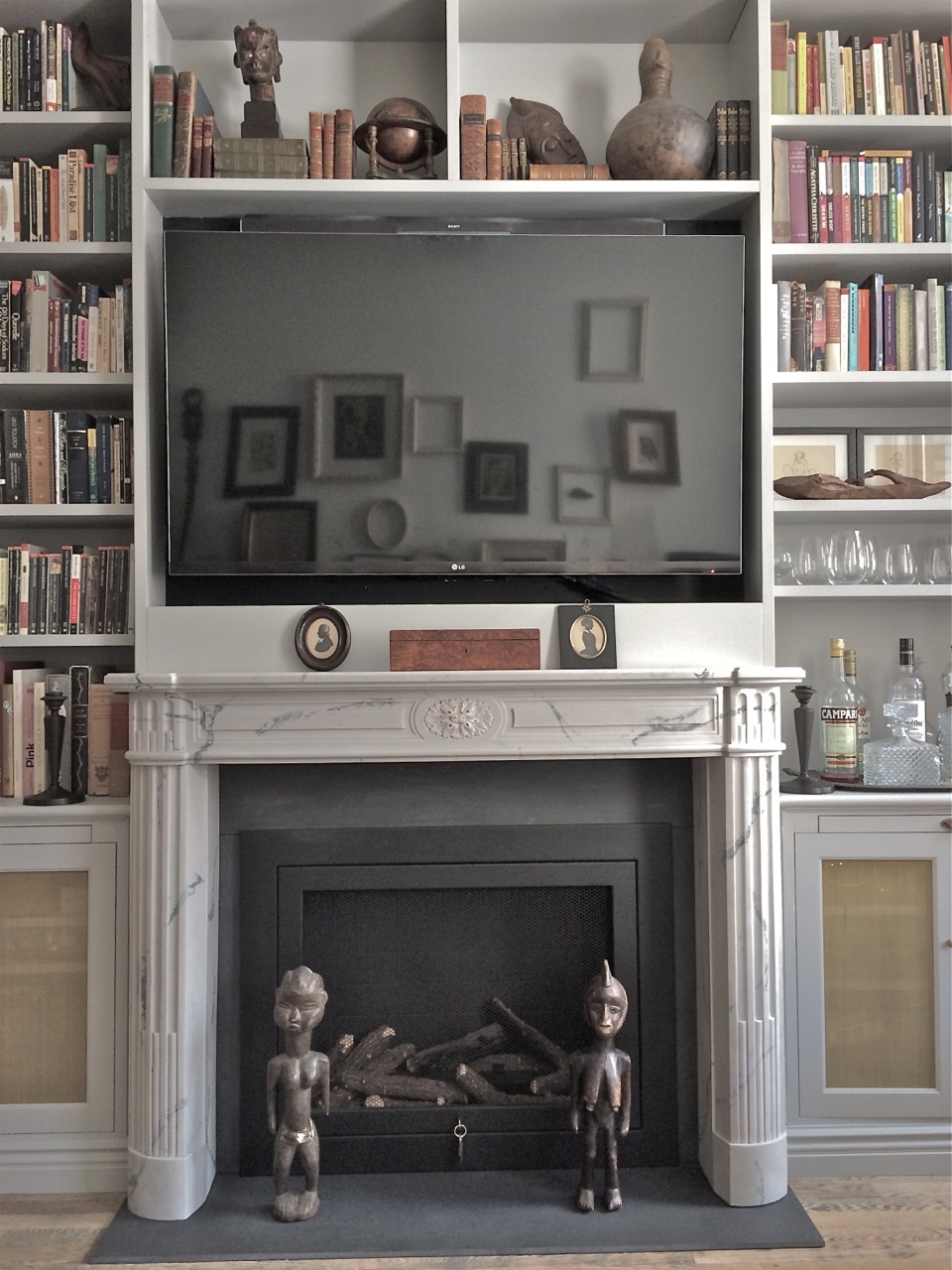 Marble Mantel in an apartment library Modern Apartment Library Marble Mantel