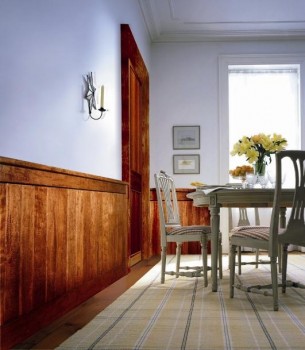 Classic Rustic distressed hand-scraped maple, show here using our Classic Rustic Casing Pak to frame a door in a dining room.