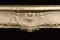 A large acanthus leaf center spray is front and center on this Louis XIV French Marble Mantel