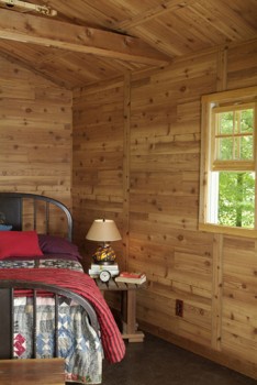 Western Red Cedar paneling in this rustic cabin bedroom - real plywood paneling