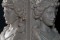 True to form, no veining touches the faces on the marble mantel caryatids