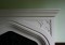 Nice geometric pattern in the spandrel of this Tudor stone mantel