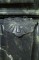 Beautiful decoration adorns the top of the marble mantel leg