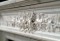 Acanthus Leaf and berries adorn the elongated center spray on this cararra marble mantel