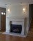 This stone mantel crosses over traditional and contemporary styles