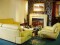 Install the electric fireplace recessed into a wall, and surround with a mantel (mantel not included)
